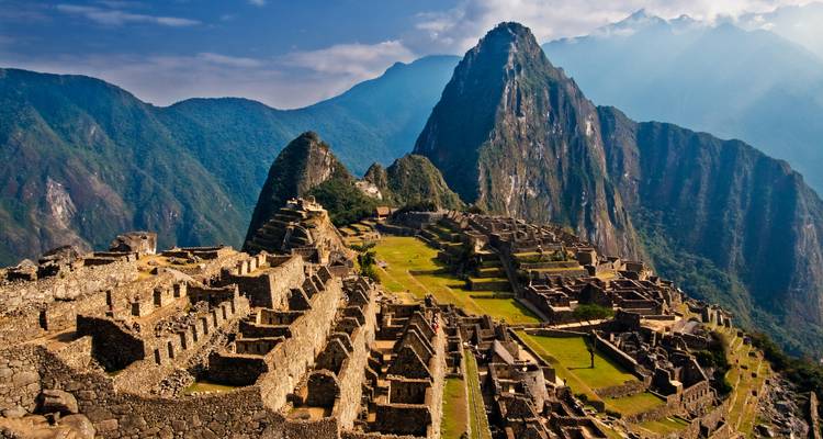 Iconic ruins and terraces of Machu Picchu set against dramatic Andean peaks.