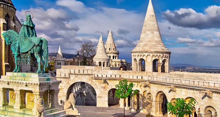 Neo-Romanesque terraces and pointed towers of Budapest’s Fisherman’s Bastion under dramatic skies.