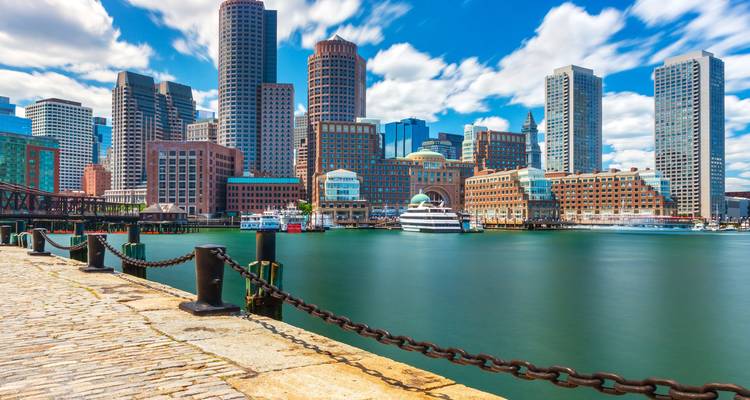 Boston waterfront with modern skyline, yachts and long exposure smooth water