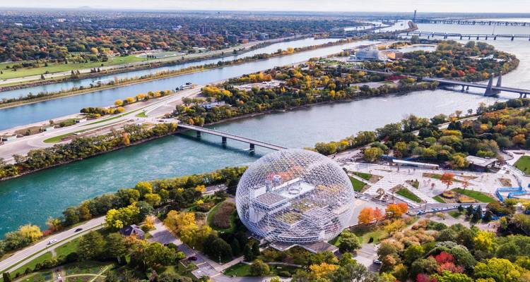 Aerial view of Montreal’s Biosphere on Saint-Helen’s Island surrounded by the St. Lawrence River and bridges.