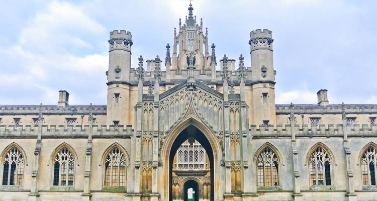 Ornate Neo-Gothic gateway of St John’s College with pinnacled tower and carved stonework in Cambridge.