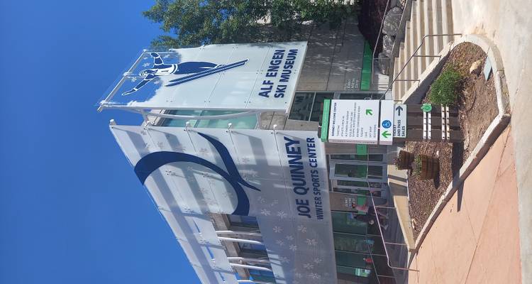 Exterior of the Alf Engen Ski Museum at Utah Olympic Park under a bright sky.