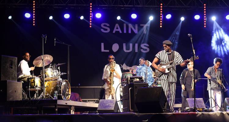 Live jazz performance on an outdoor stage at Saint-Louis Festival.