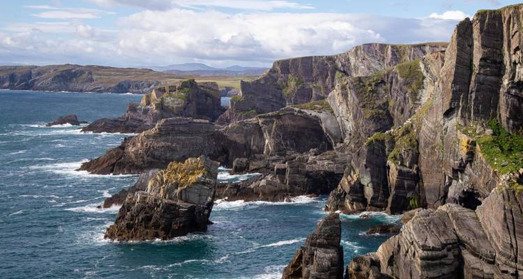 Dramatic sea cliffs and rock stacks battered by Atlantic waves on Ireland’s southwest coast.