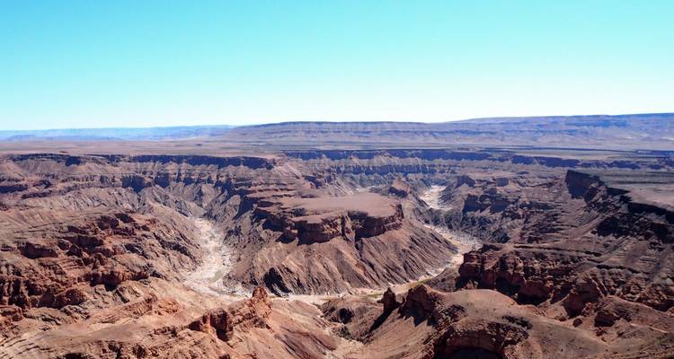 Expansive view over the rugged cliffs and dry riverbed of Fish River Canyon