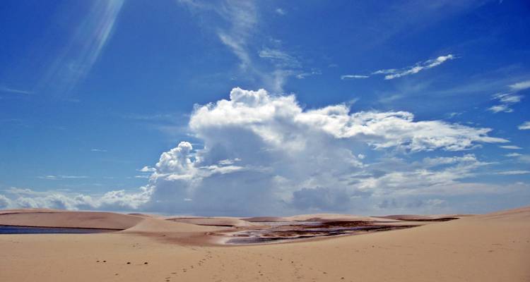 Endless white sand dunes of Lençóis Maranhenses beneath a dramatic sky