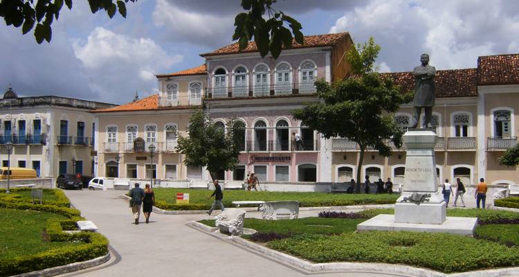 Central square of São Luís with colonial buildings, statue and locals strolling