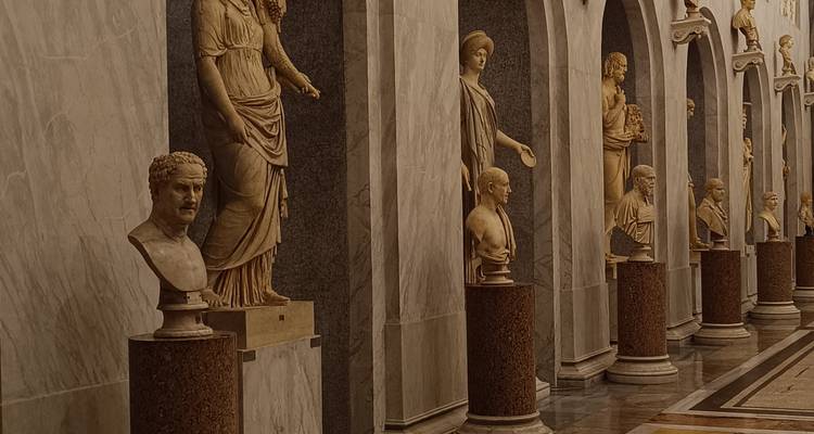 Corridor of classical marble statues inside the Vatican Museums