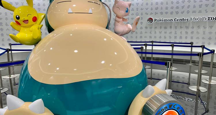 Large Snorlax, Pikachu and Mew figures inside Pokémon Center Tokyo DX showroom.