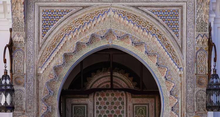 Intricately carved Moorish archway with colourful geometric tile work