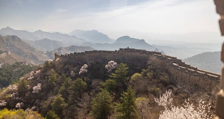 A view of the Great Wall of China snaking through the mountains.