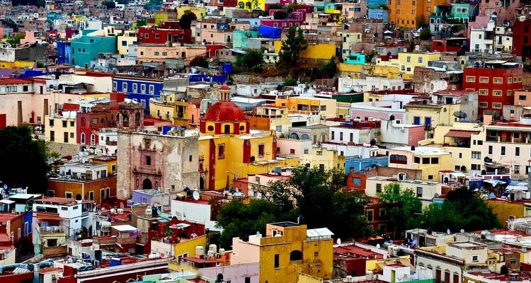 Colorful cityscape with densely packed buildings.