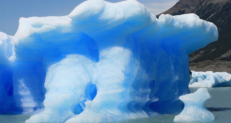 Close-up of a blue glacier in an icy landscape
