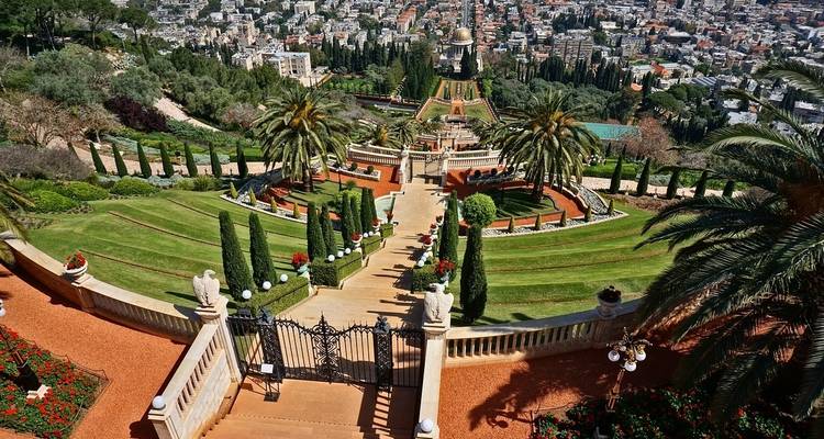 Panoramic view of terraced gardens overlooking a city.