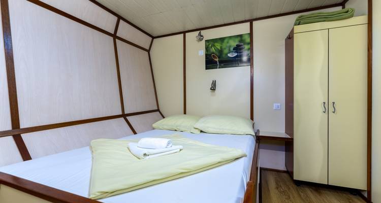 Double bed cabin with simplistic decor.
