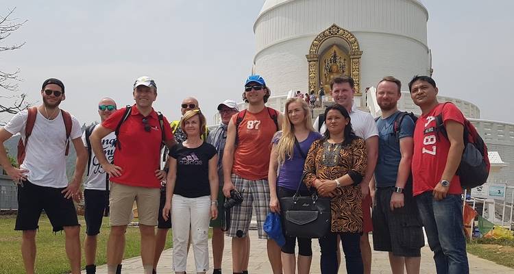 Group photo in front of a large stupa.