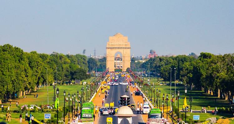 Wide boulevard leading to a monument in a park.