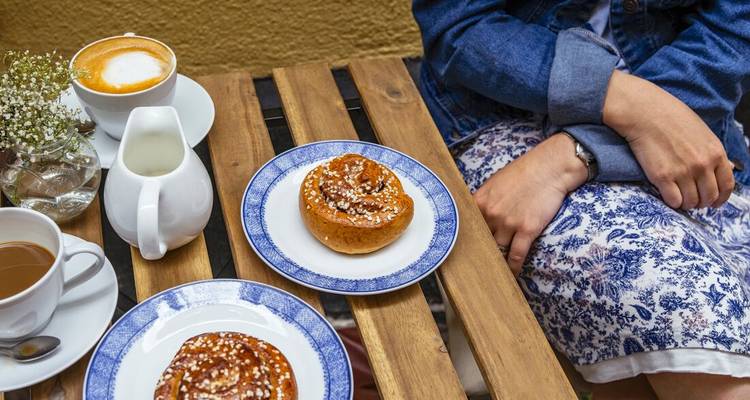 Close-up of a traditional fika setup with pastries and coffee.