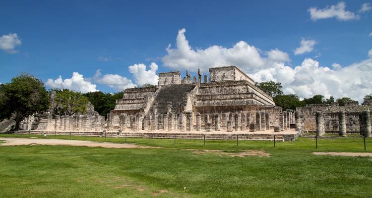 Ruined Temple of the Warriors complex with rows of stone columns at Chichen Itza
