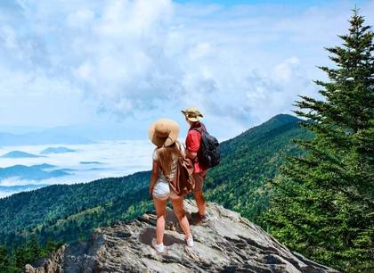 A couple staring out from the Great Smoky Mountains on the Appalachian Trail near Asheville