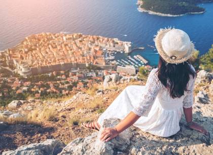 A woman admiring the almost aerial view of Dubrovnik city