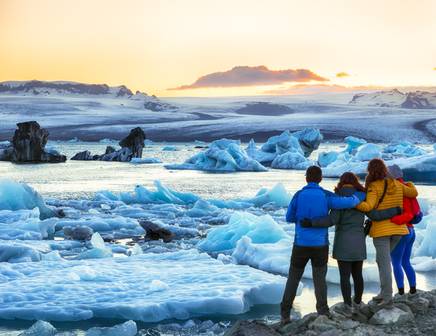 A group of friends staring out over the Diamond Beach in Iceland