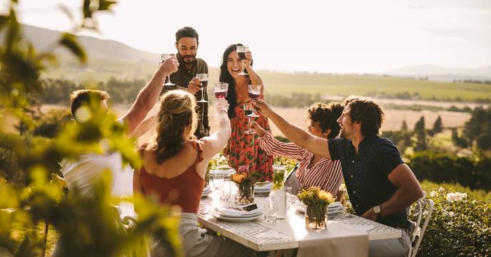 a group of travellers sampling and enjoying wine tasting in tuscany