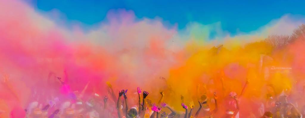 A group of people throwing colourful powder at the Holi Festival in Jaipur, India