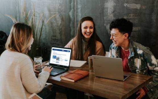 A small business owner utilising the TourRadar integration on her laptop