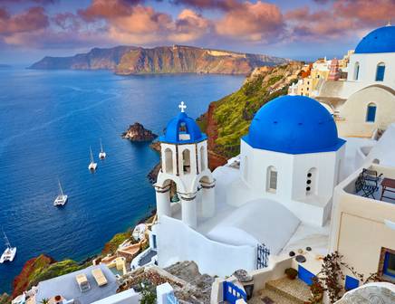 The blue domes of Santorini Island on a sailing tour of Greece