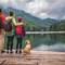 Family admiring a lake