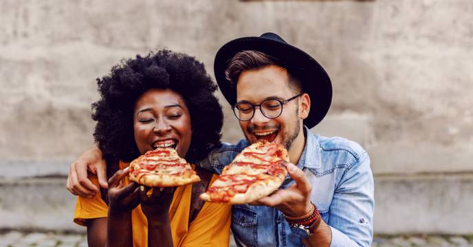 Couple enjoying pizza