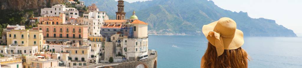 Woman enjoying the view of a town at Amalfi Coast