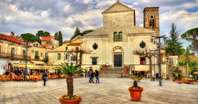 People walking the streets of an old town in Italy