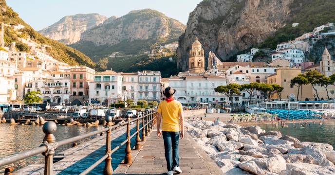 Person walking toward the village of Amalfi, Italy