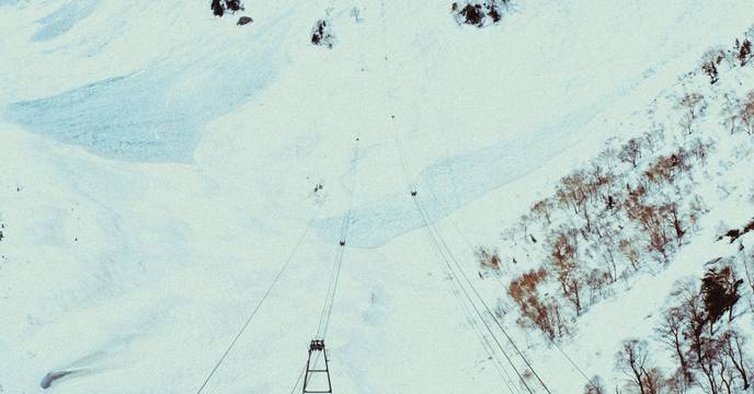 A ski lift in the snowy Japanese Alps