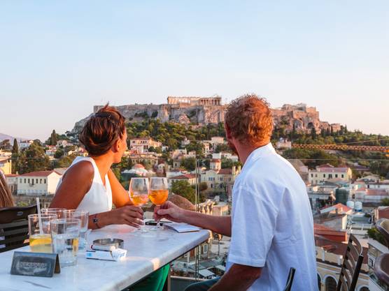 Couple enjoying the view of the Acropolis in Athens