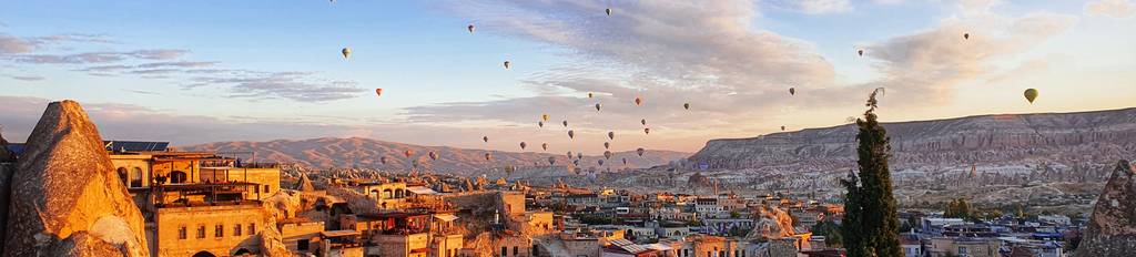 Hot air balloons flying over Cappadocia