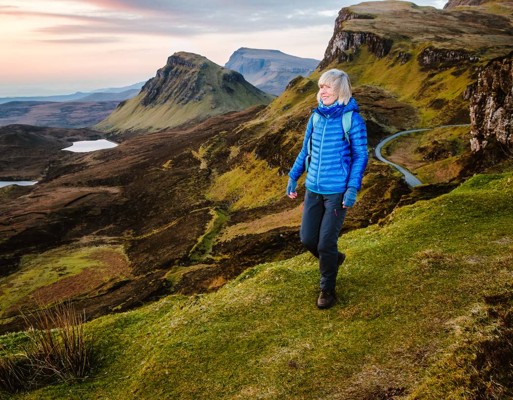 A senior solo traveler hiking