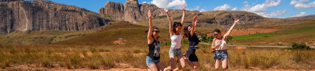 Travelers jumping from joy