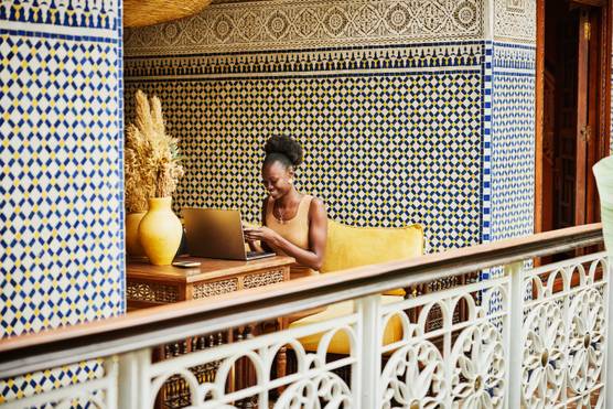 Travel Agent booking trips on laptop