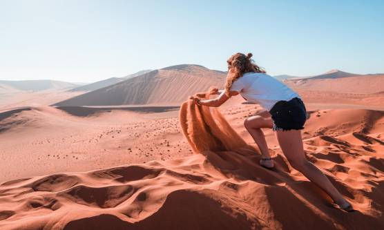 child playing in the sand dunes