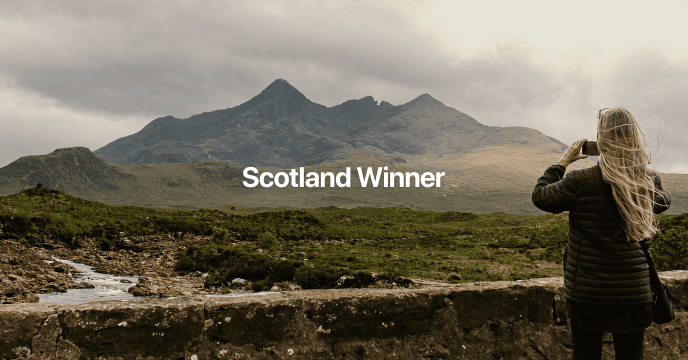 Misty Scottish highlands with rolling green hills