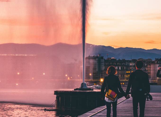 Couple walking on a dock, Lake Geneva