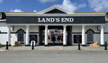 Entryway to Land's End visitor center with signs.