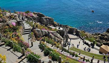 Coastal landscape with rocky cliffs and ocean view.
