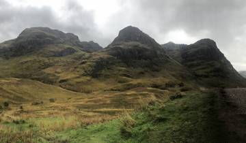 Mountain landscape under a cloudy sky.