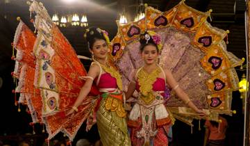 Two women in traditional, colorful Thai costumes.