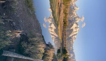 Majestic mountain range reflecting in calm waters.