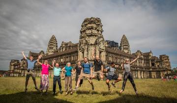 Group of people jumping in front of Angkor Wat
